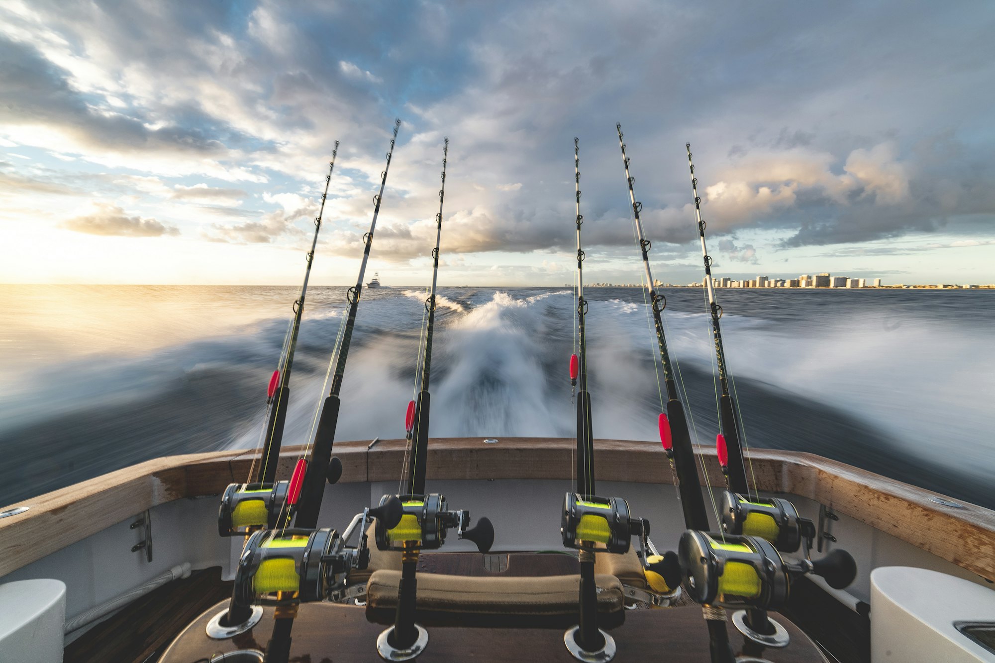 Rods set in the rocket launcher of a charter boat running offshore